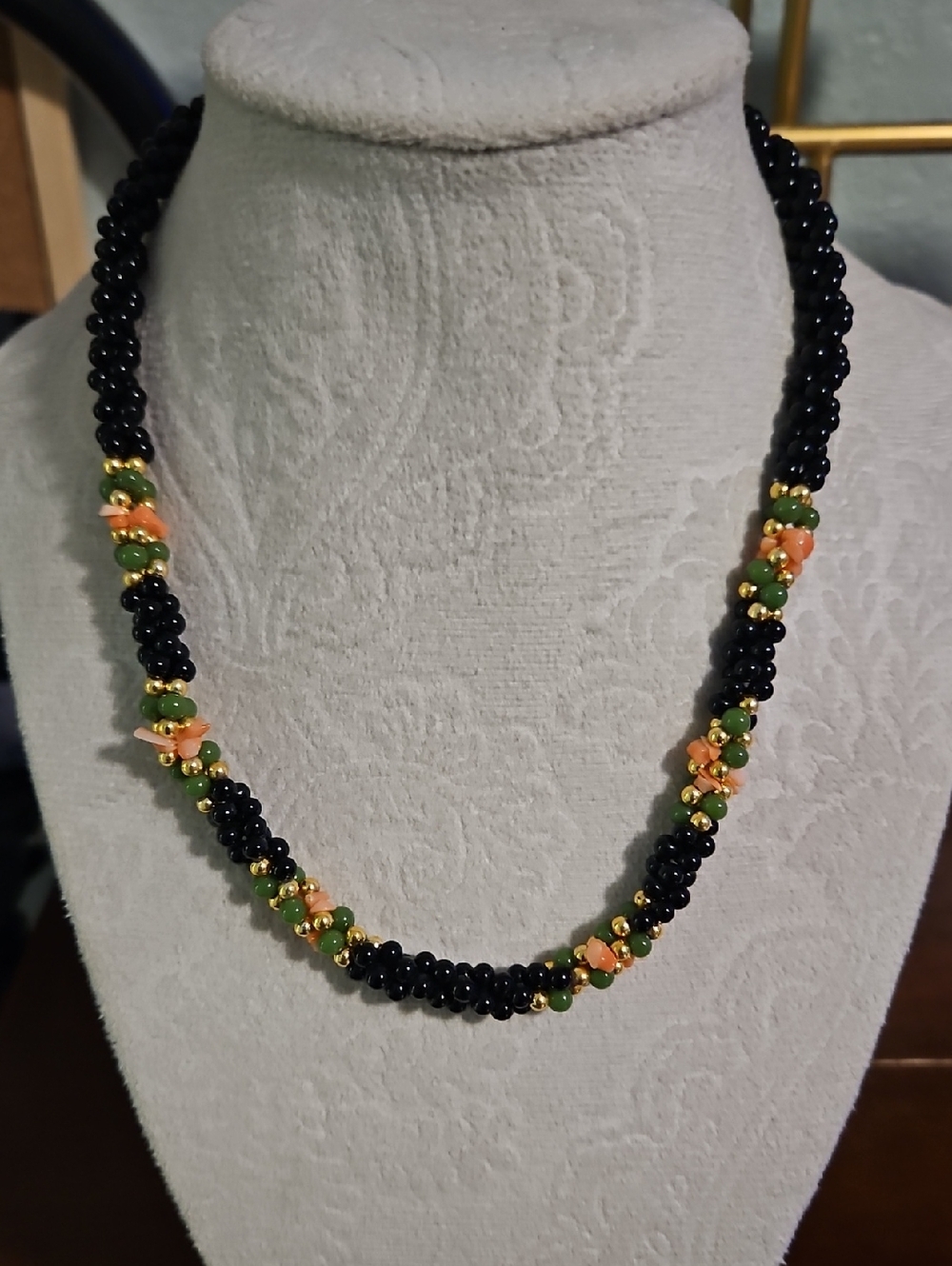 Black Beaded Necklace with Green & Peach Accents